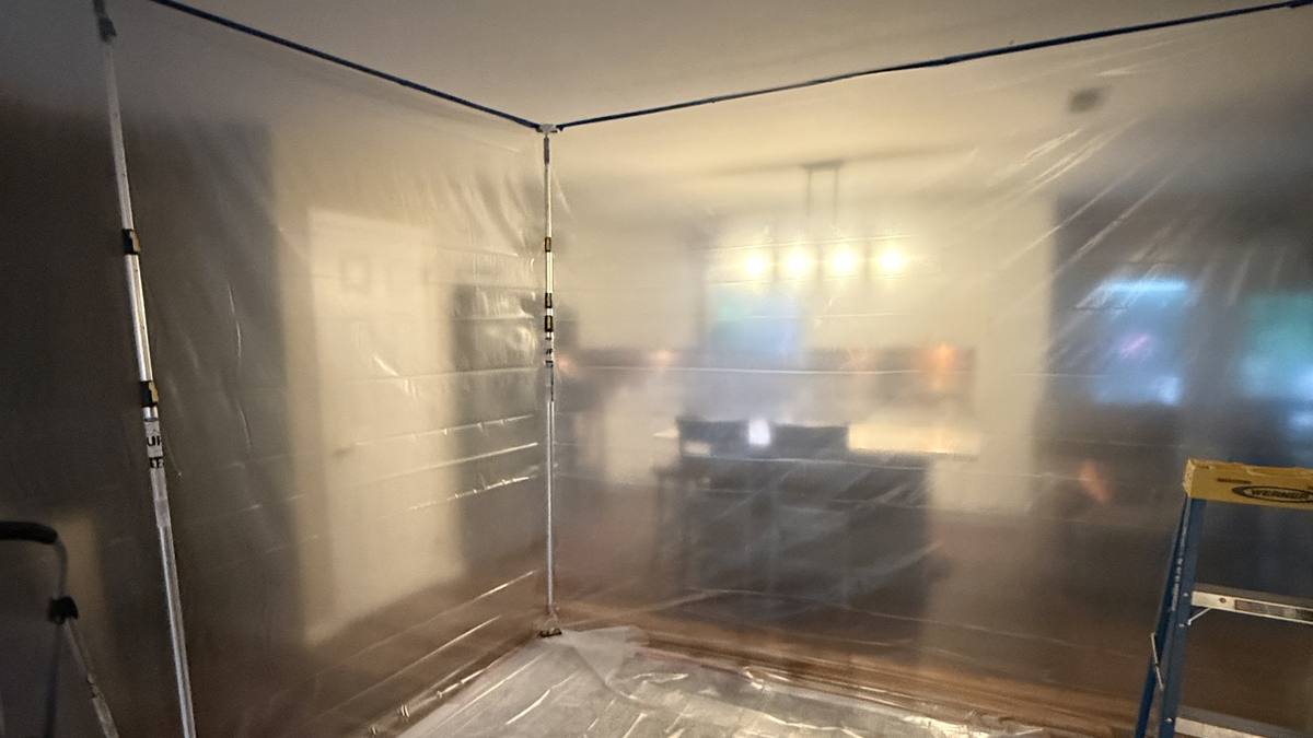 Containment barrier set up for a contaminated-water cleanup in a Charleston home